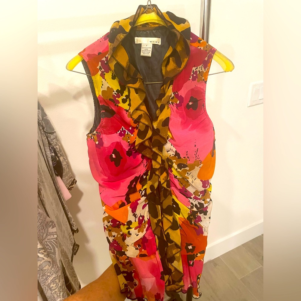 Sleeveless, form fitting, blouse